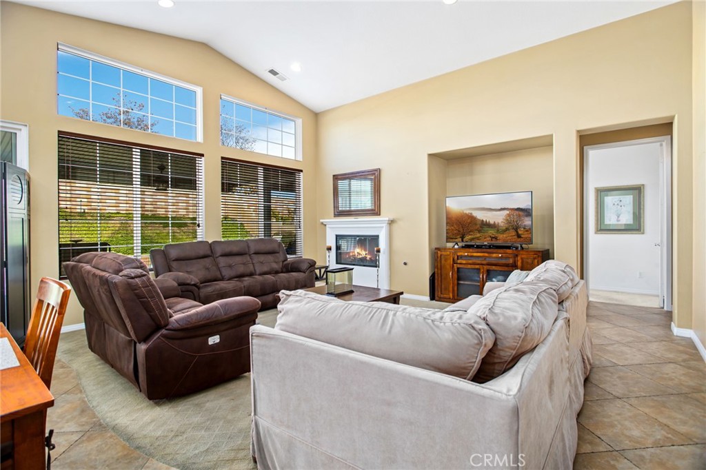 31677 Middlebrook Lane Menifee, CA 92584 - Photo 11 of 42 a living room with furniture and a flat screen tv