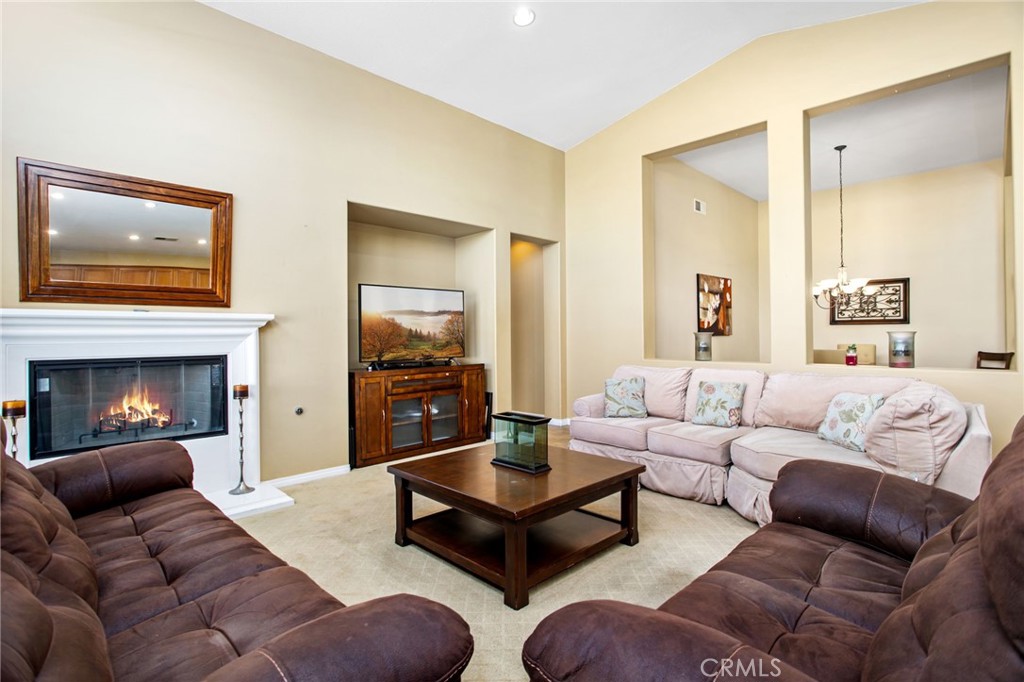 31677 Middlebrook Lane Menifee, CA 92584 - Photo 12 of 42 a living room with furniture and a fireplace