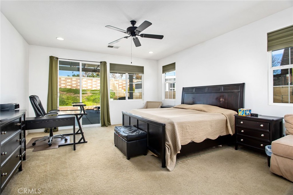 31677 Middlebrook Lane Menifee, CA 92584 - Photo 17 of 42 a bed room with a bed and furniture