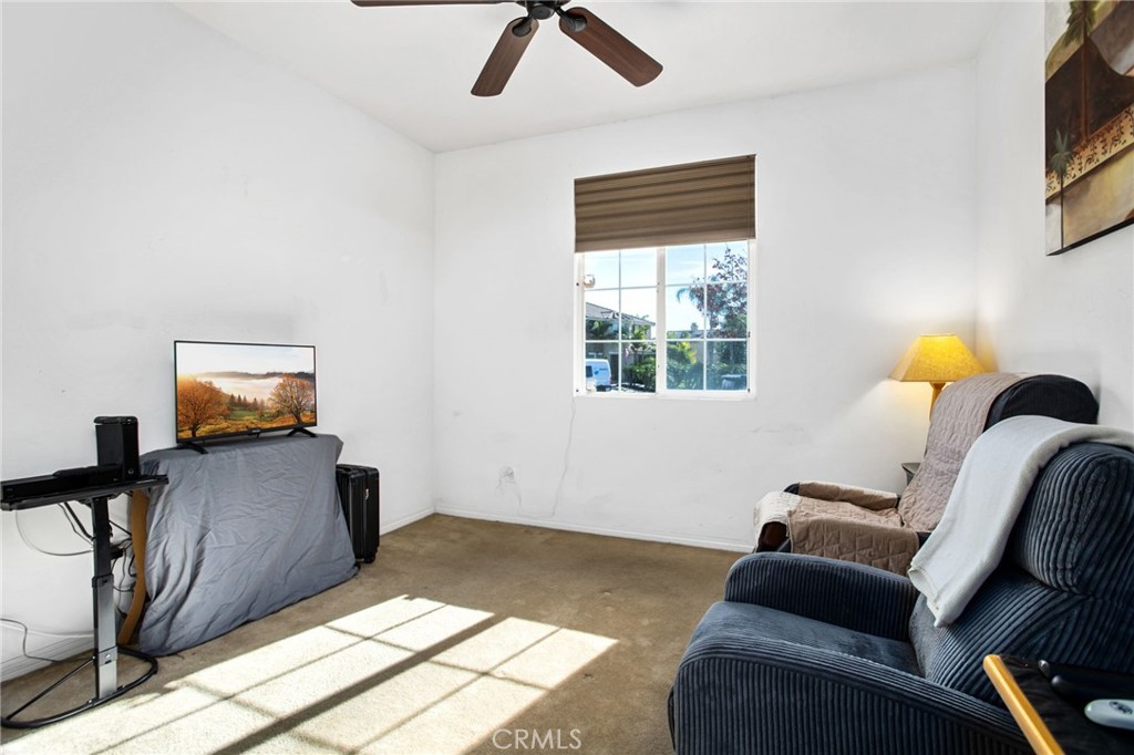 31677 Middlebrook Lane Menifee, CA 92584 - Photo 25 of 42 a bedroom with furniture and a window