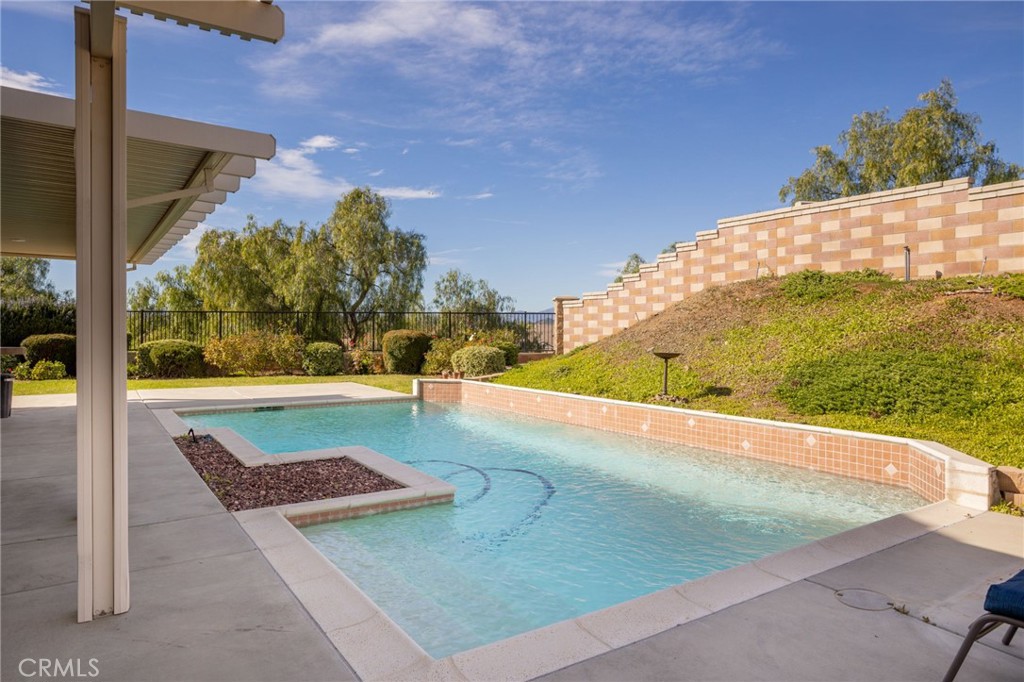 31677 Middlebrook Lane Menifee, CA 92584 - Photo 28 of 42 a view of a swimming pool with an outdoor space