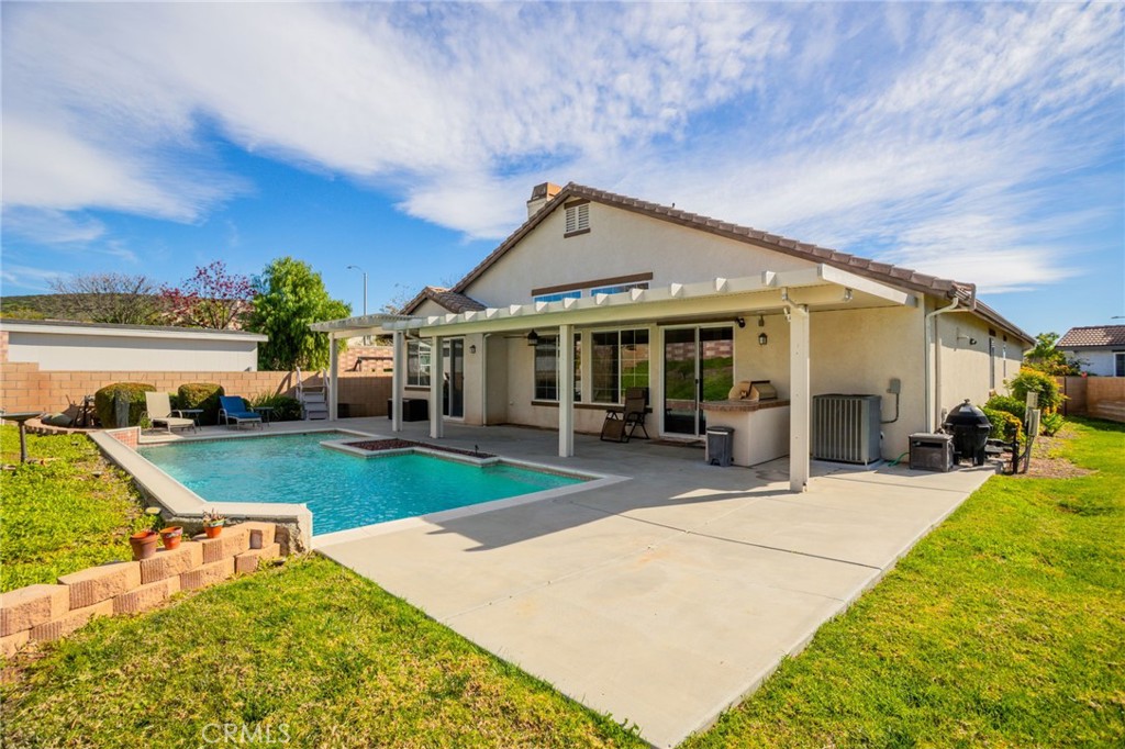 31677 Middlebrook Lane Menifee, CA 92584 - Photo 30 of 42 a view of a house with swimming pool and sitting area
