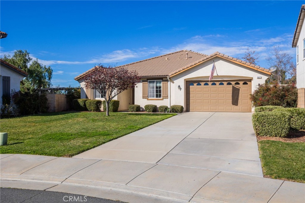 31677 Middlebrook Lane Menifee, CA 92584 - Photo 3 of 42 a front view of a house with a yard