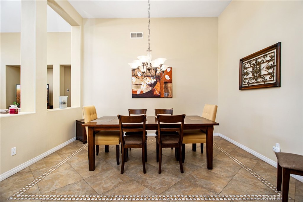 31677 Middlebrook Lane Menifee, CA 92584 - Photo 8 of 42 a view of a dining room with furniture