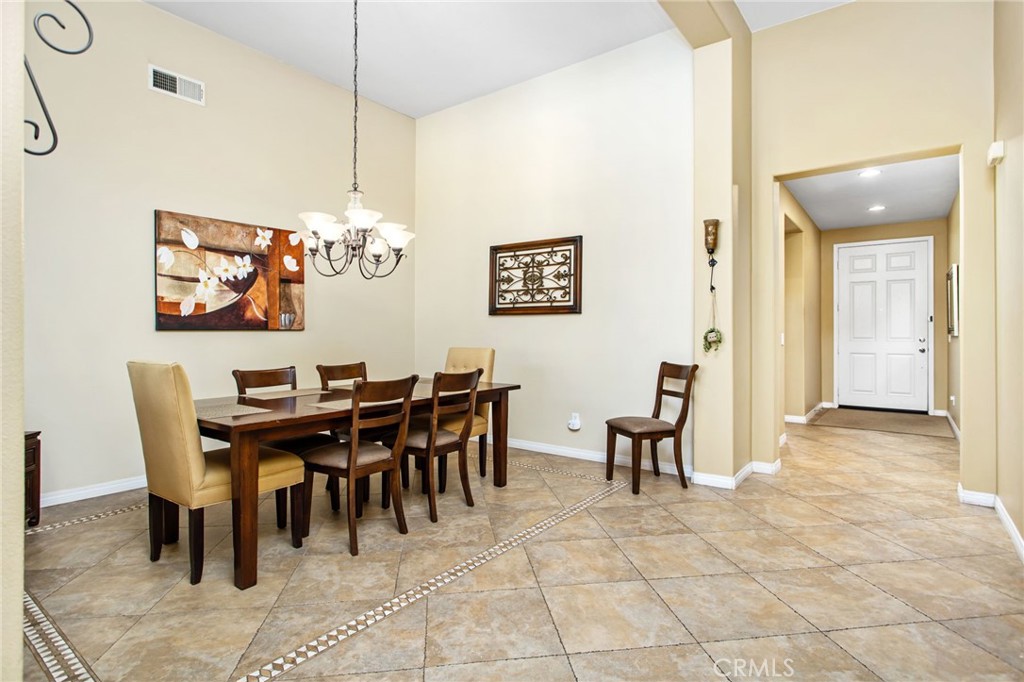 31677 Middlebrook Lane Menifee, CA 92584 - Photo 9 of 42 a view of a dining room with furniture