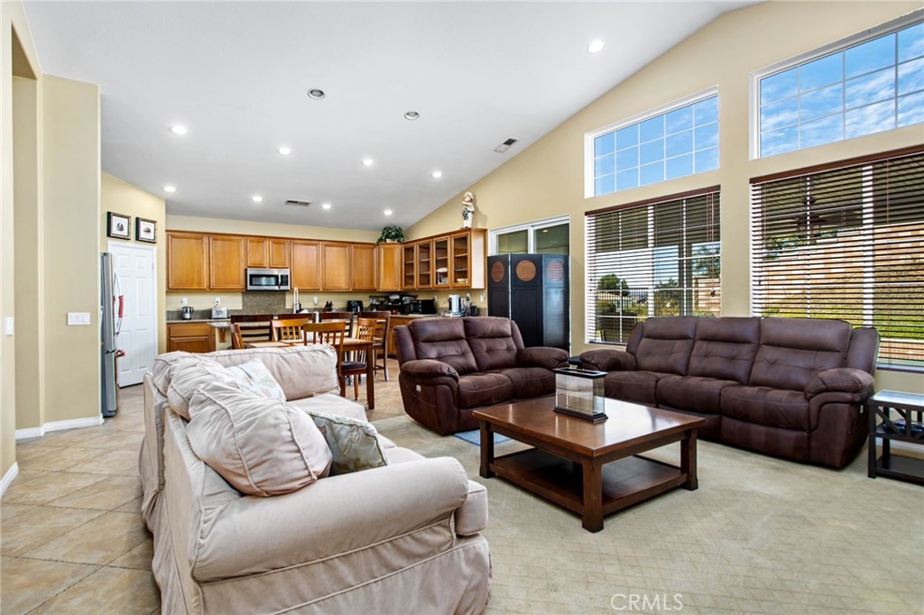 31677 Middlebrook Lane Menifee, CA 92584 - Photo 10 of 42 a living room with furniture kitchen view and a large window