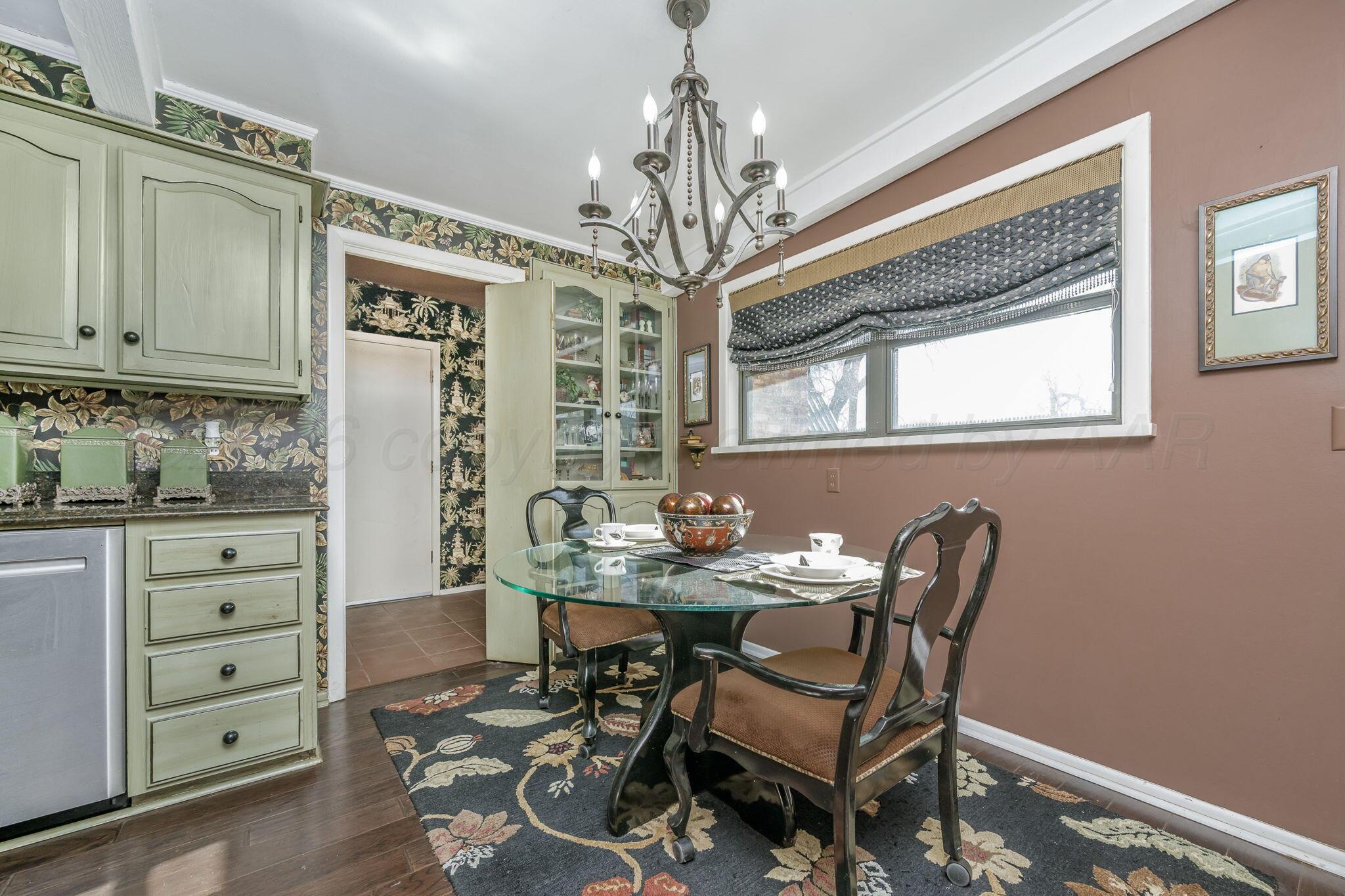 3603 Hancock Street Amarillo, TX 79109 - Photo 11 of 23 a view of a dining room with furniture and chandelier