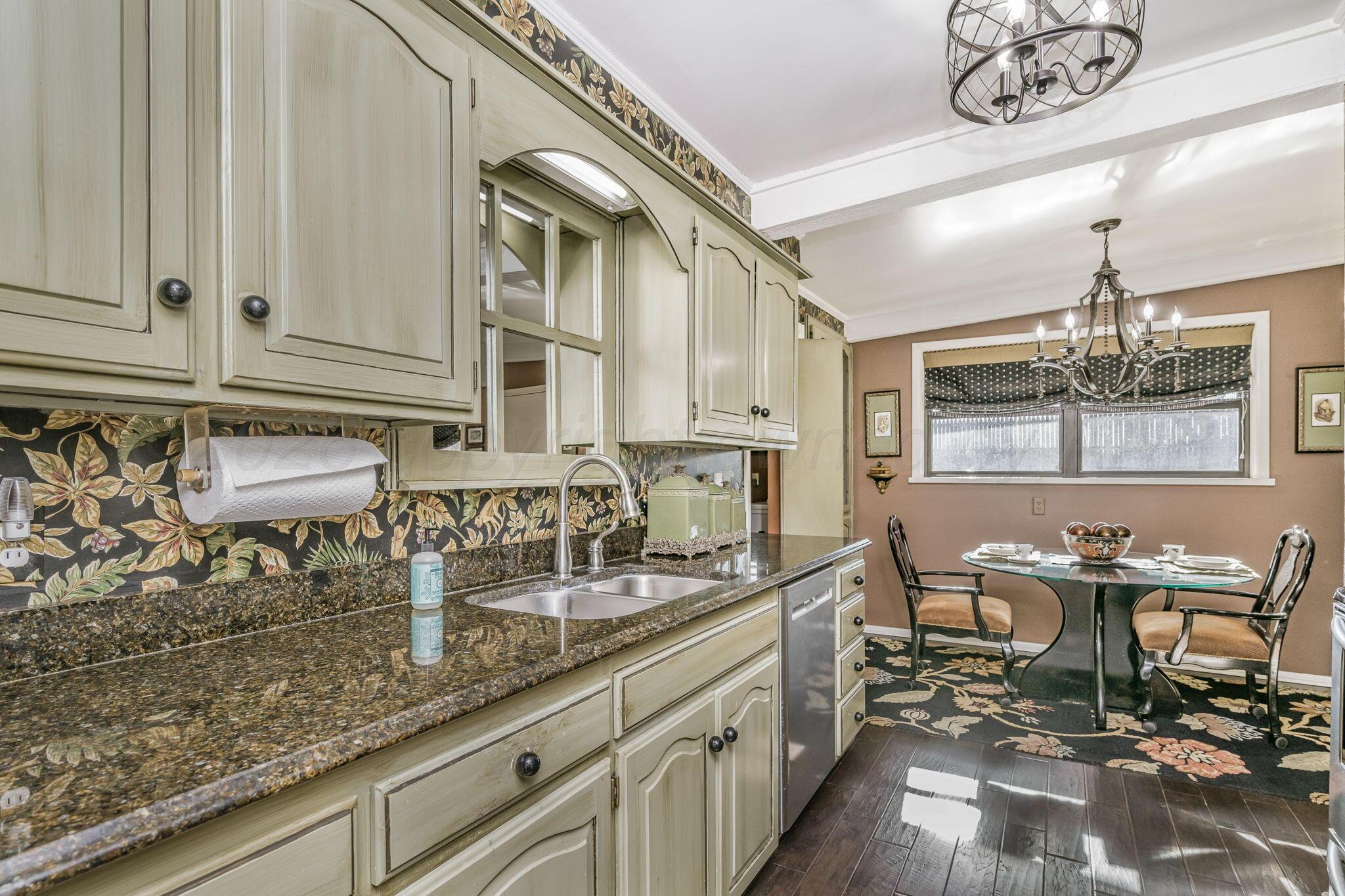 3603 Hancock Street Amarillo, TX 79109 - Photo 15 of 23 a kitchen with stainless steel appliances granite countertop a sink and cabinets