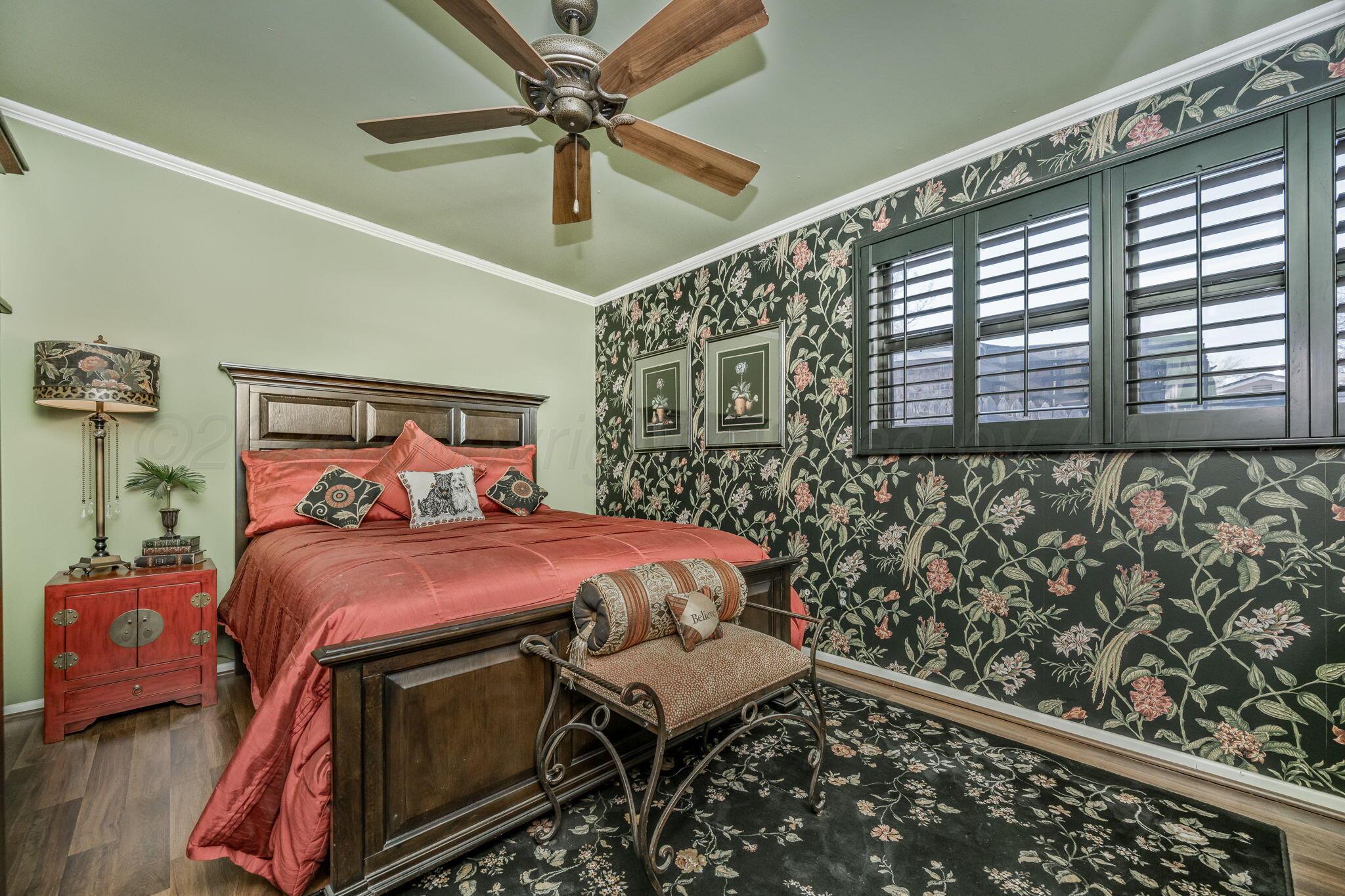 3603 Hancock Street Amarillo, TX 79109 - Photo 18 of 23 a bed sitting in a bedroom next to a window