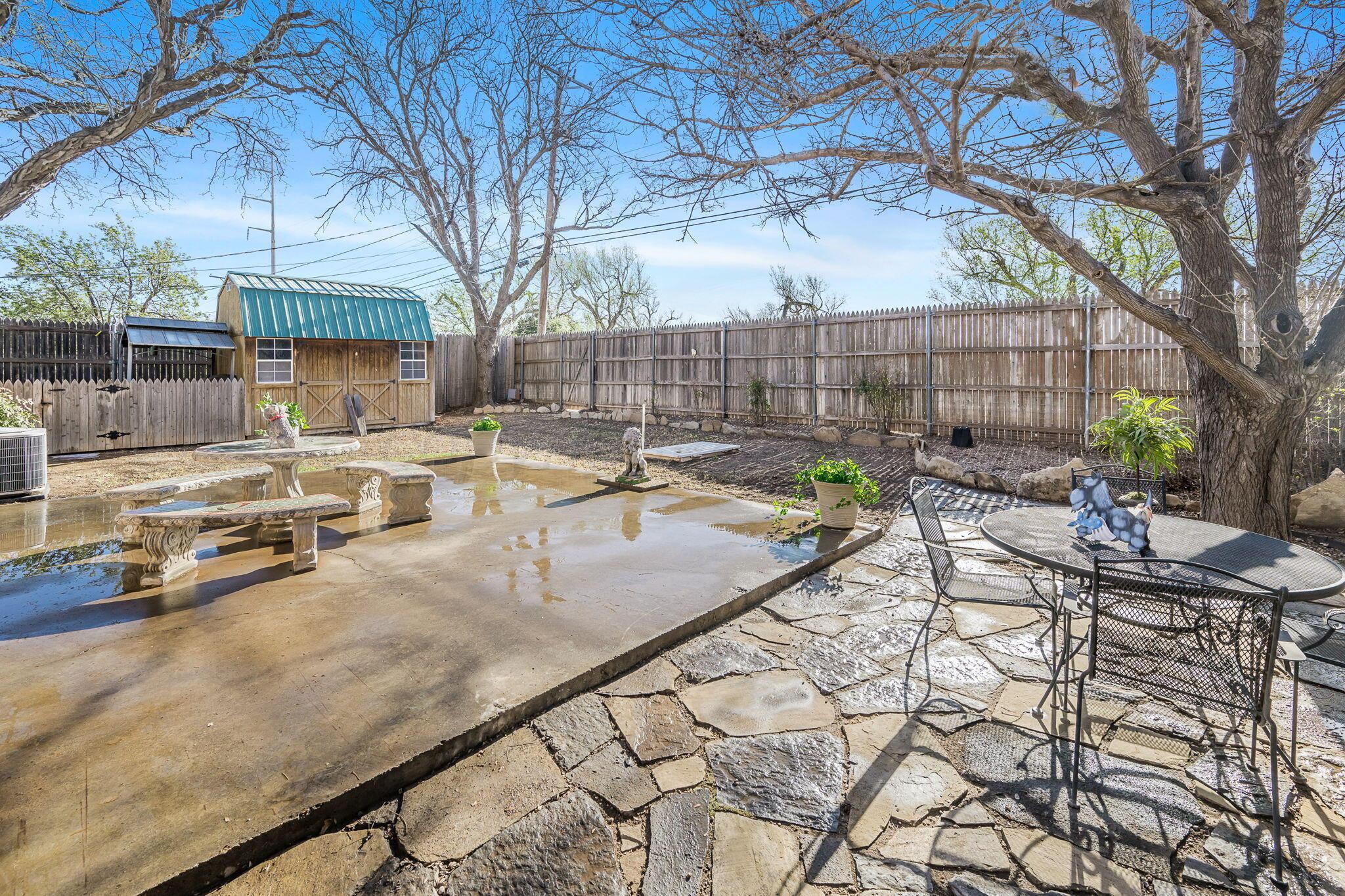 3603 Hancock Street Amarillo, TX 79109 - Photo 2 of 23 a view of a backyard with sitting area