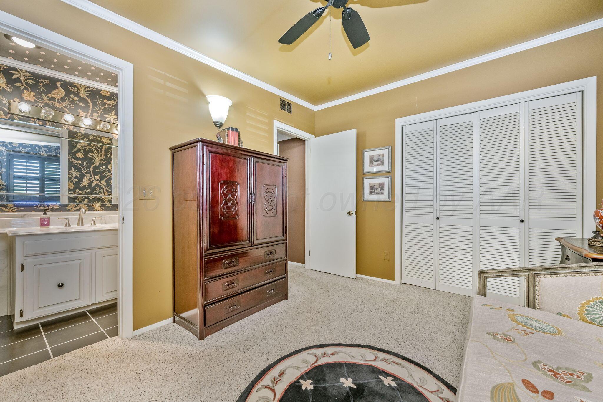 3603 Hancock Street Amarillo, TX 79109 - Photo 21 of 23 a bedroom with a bed and a dresser