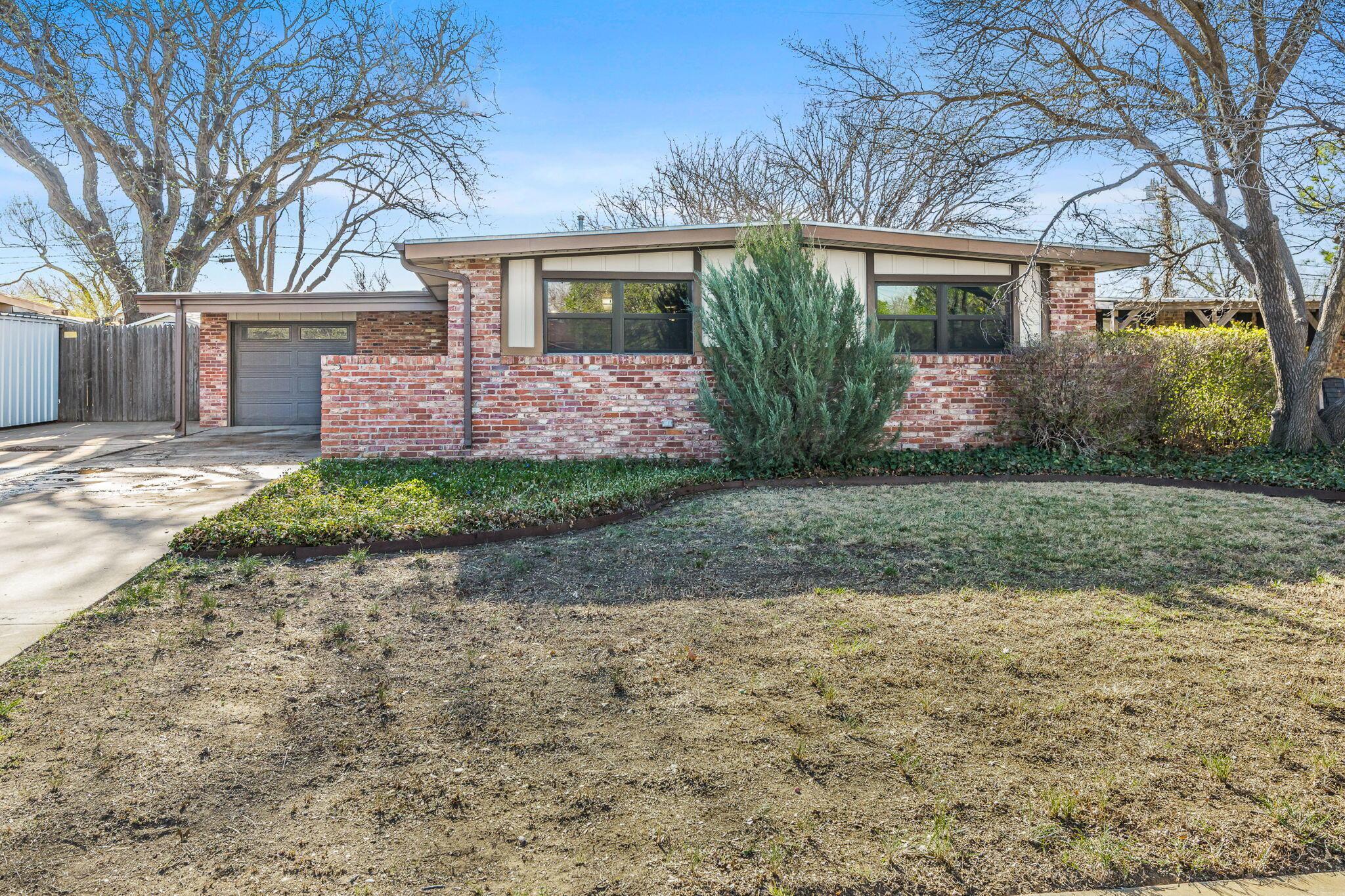 3603 Hancock Street Amarillo, TX 79109 - Photo 23 of 23 a front view of a house with garden