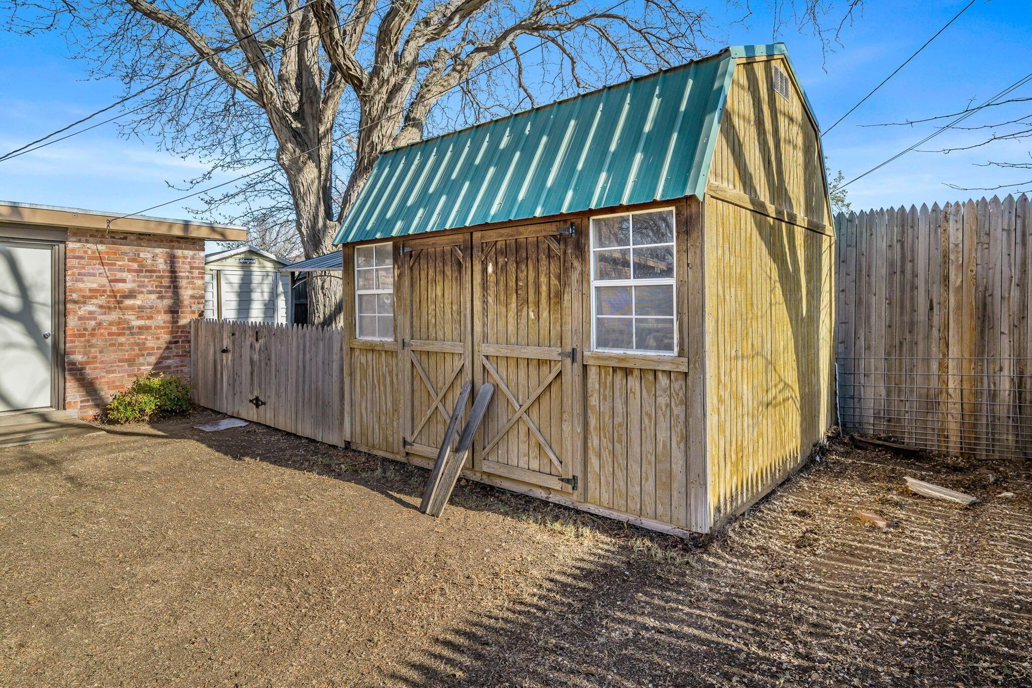 3603 Hancock Street Amarillo, TX 79109 - Photo 5 of 23 a view of a house with backyard and wooden fence