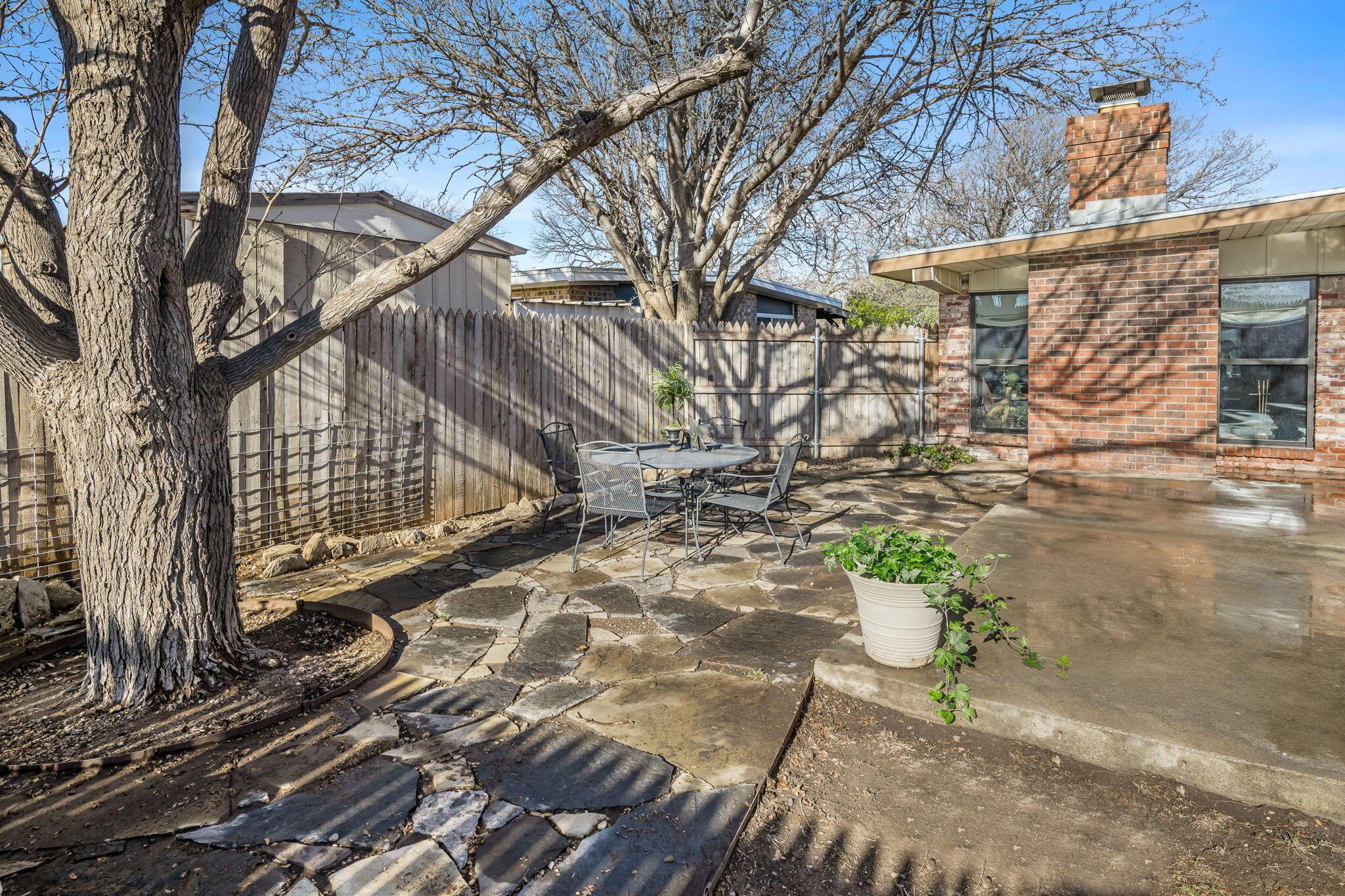 3603 Hancock Street Amarillo, TX 79109 - Photo 6 of 23 a view of a yard with plants and trees