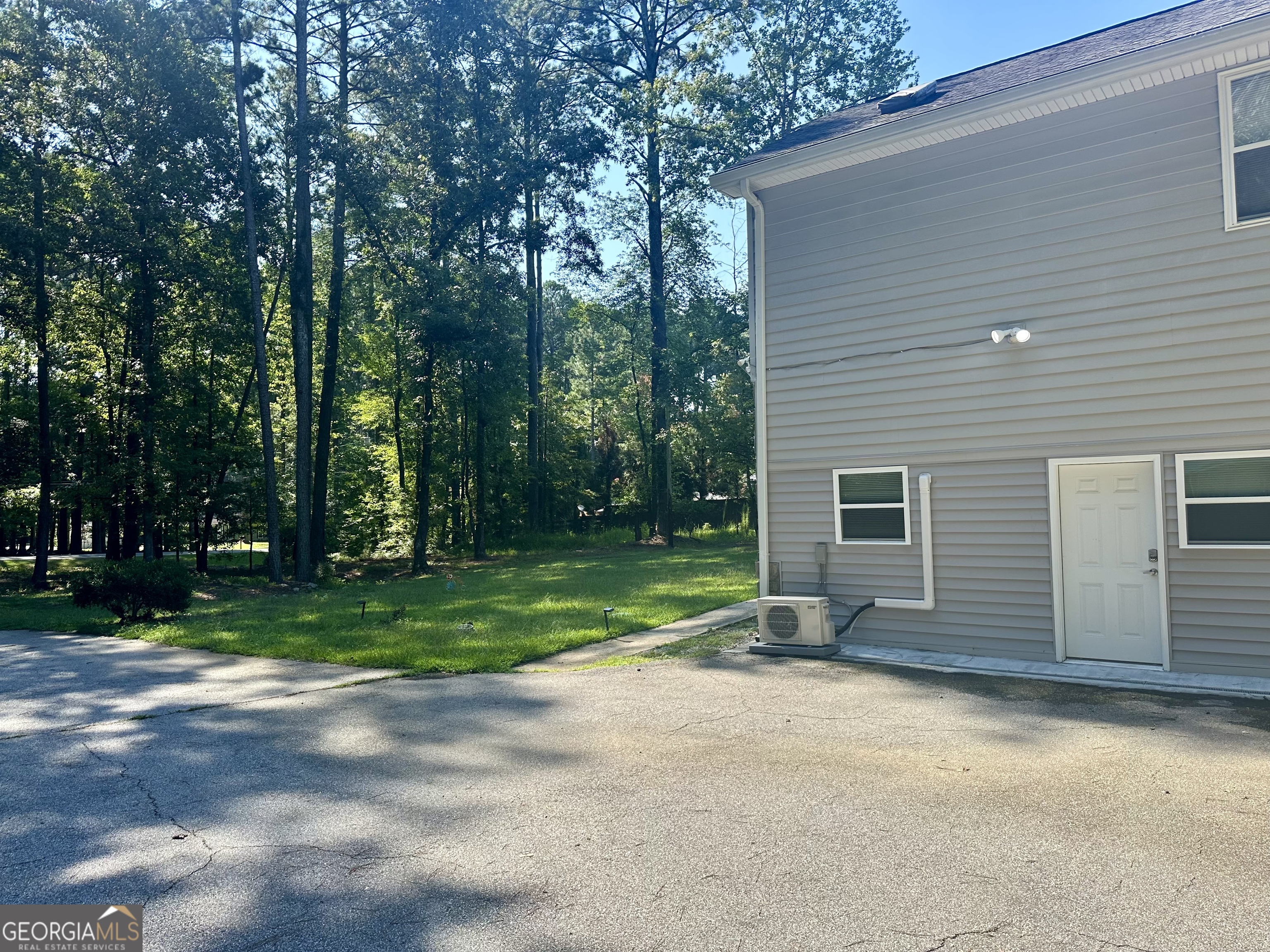 110 Julie Road Tyrone, GA 30290 - Photo 2 of 9 a view of a house with backyard and trees