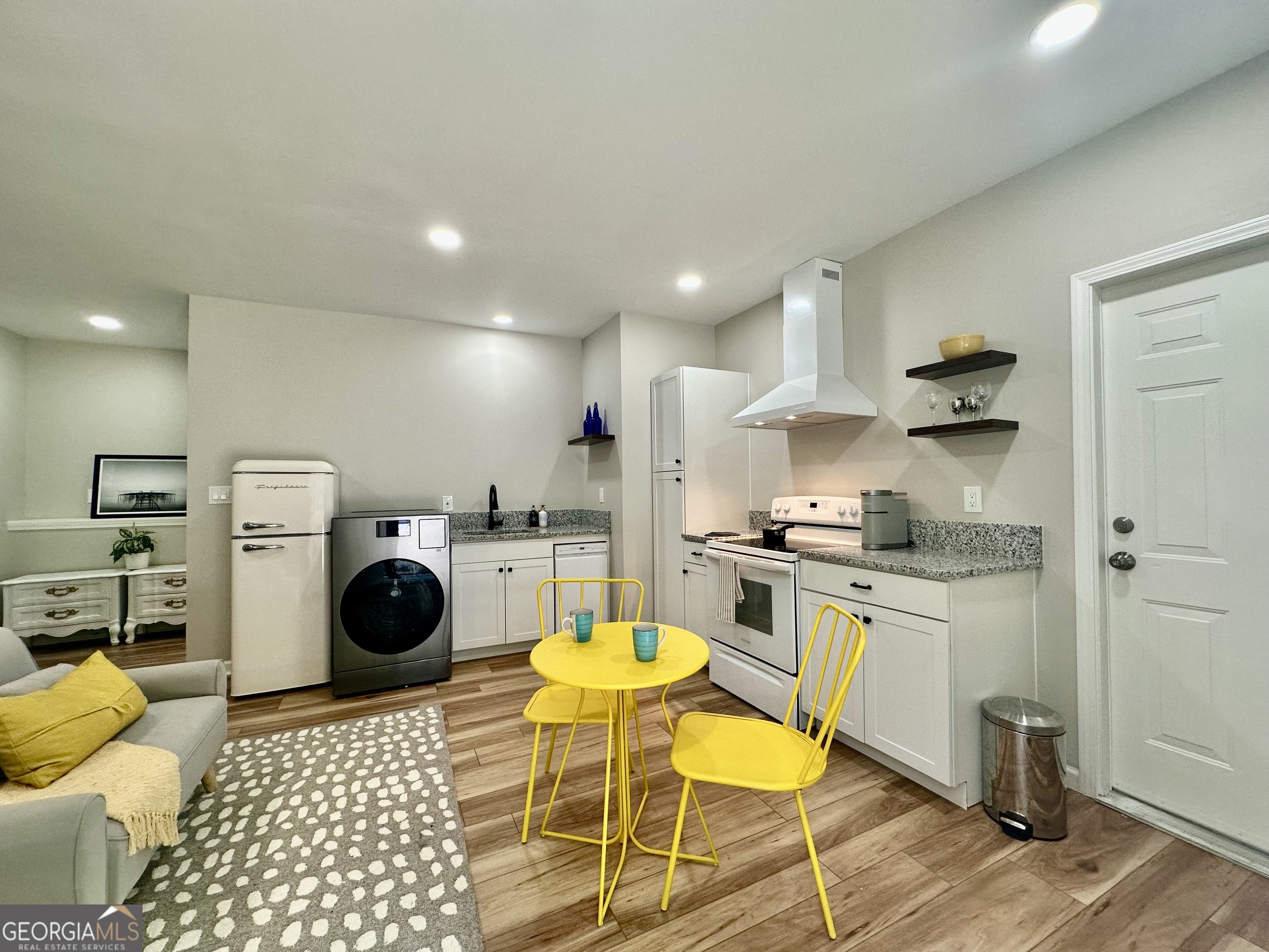 110 Julie Road Tyrone, GA 30290 - Photo 3 of 9 a kitchen with a sink a stove and cabinets