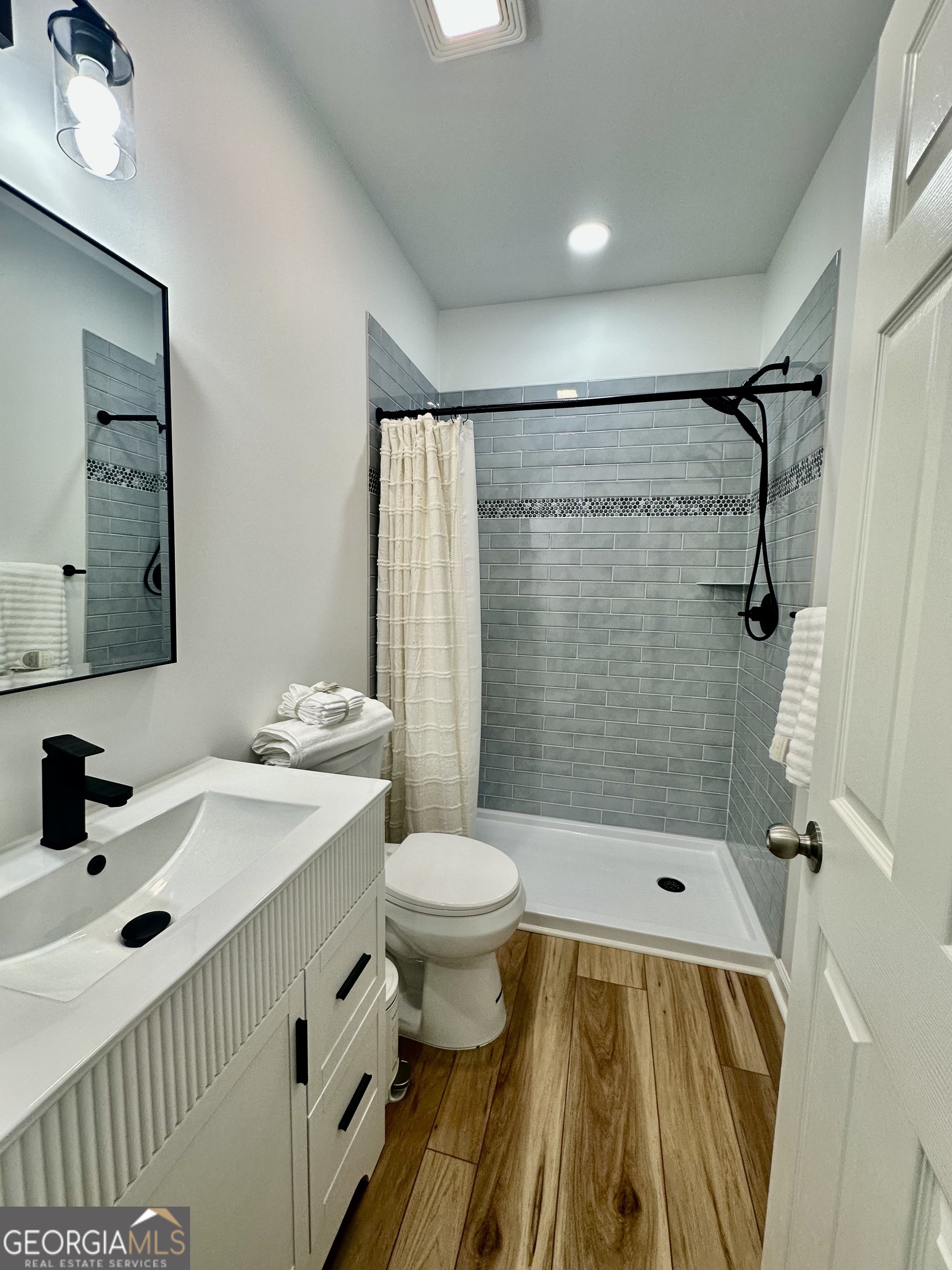 110 Julie Road Tyrone, GA 30290 - Photo 7 of 9 a bathroom with a sink and a mirror