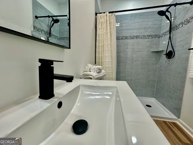 a bathroom with a sink and mirror
