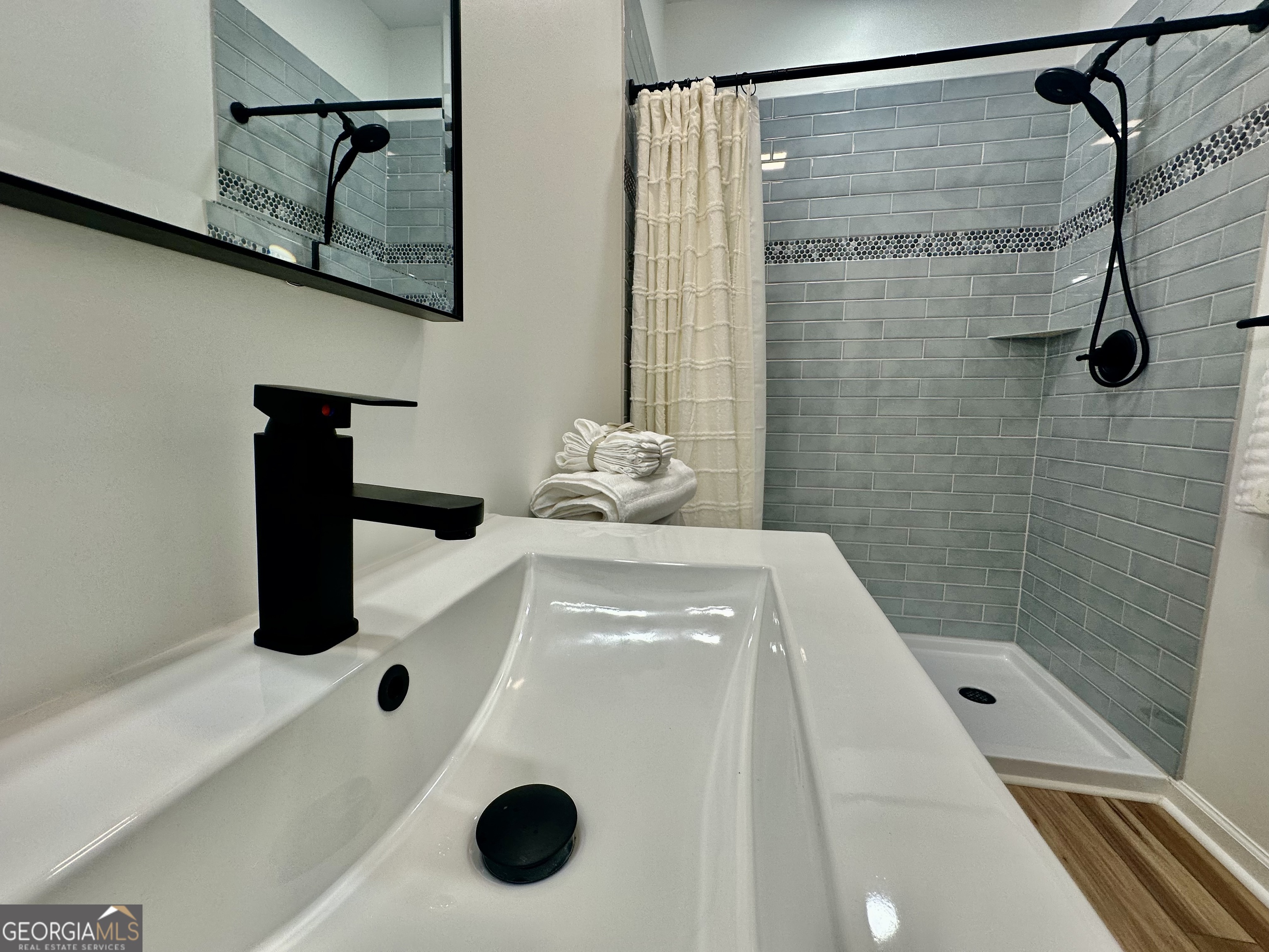 110 Julie Road Tyrone, GA 30290 - Photo 8 of 9 a bathroom with a sink and mirror