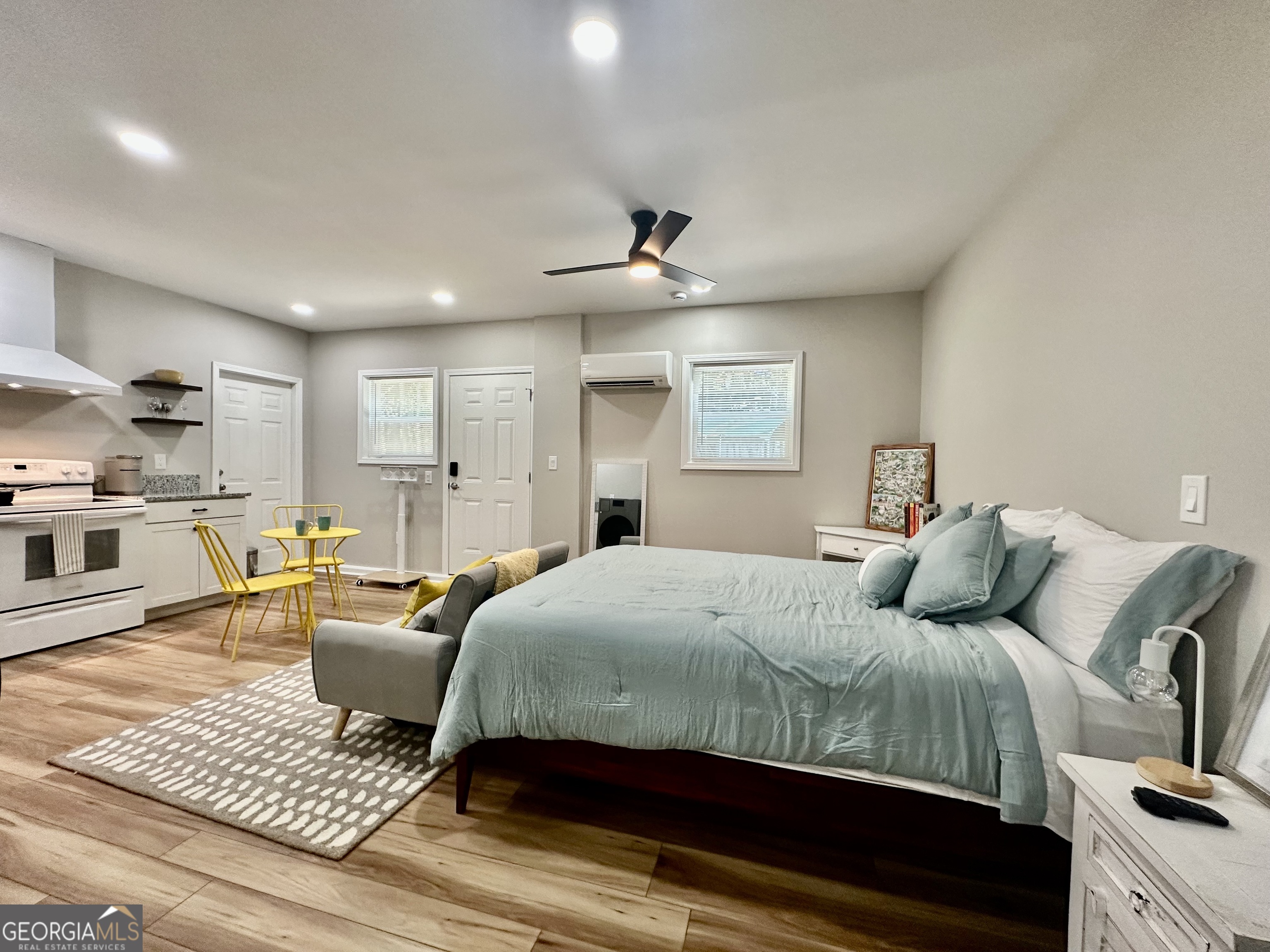 110 Julie Road Tyrone, GA 30290 - Photo 9 of 9 a bedroom with a bed a couch and dresser