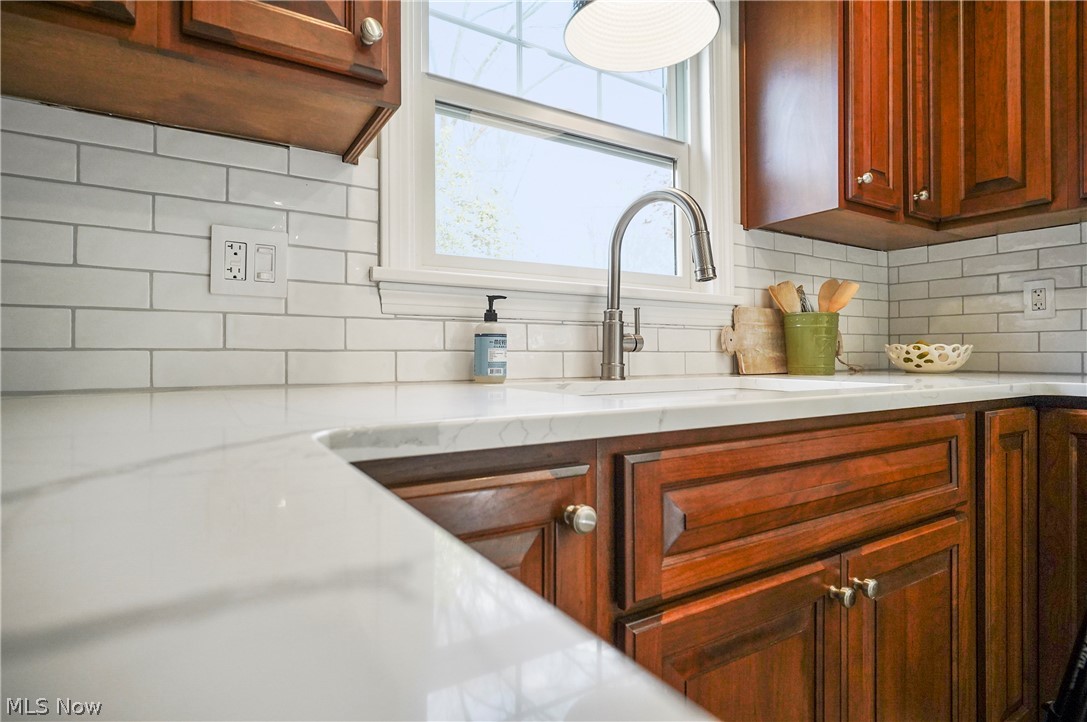 474 Malvern Road Akron, OH 44303 - Photo 25 of 47 Kitchen with tasteful backsplash, sink, and light stone countertops