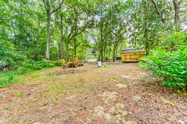 a view of a backyard with a sitting area