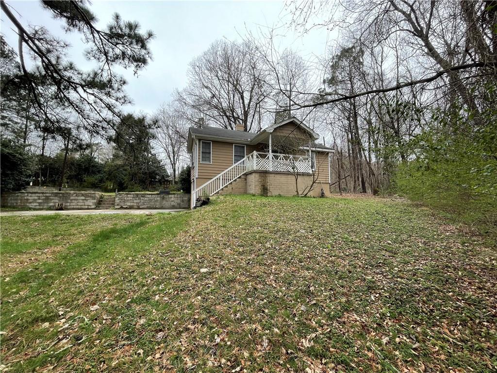 2904 Hicks Road Marietta, GA 30060 - Photo 1 of 1 a view of a house with a yard
