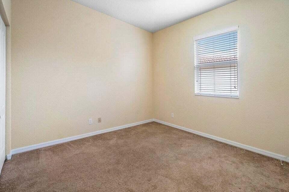 107 Chub Cay Way Jupiter, FL 33458 - Photo 14 of 15 an empty room with a window