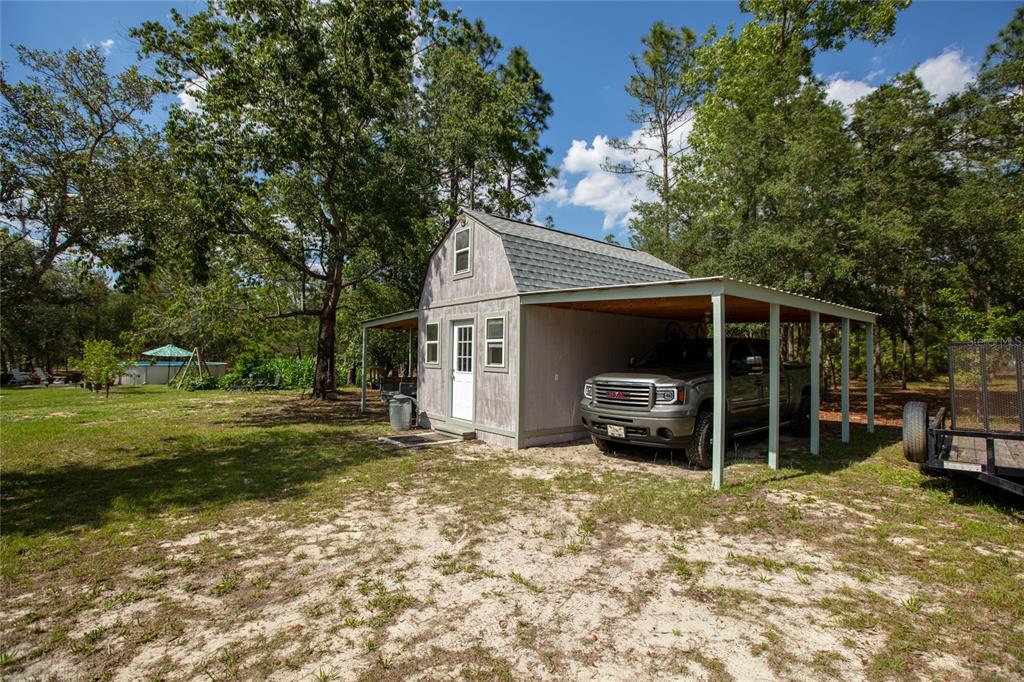 5670 Acadia Street Keystone Heights, FL 32656 - Photo 11 of 65 a view of a car parked in front of a house