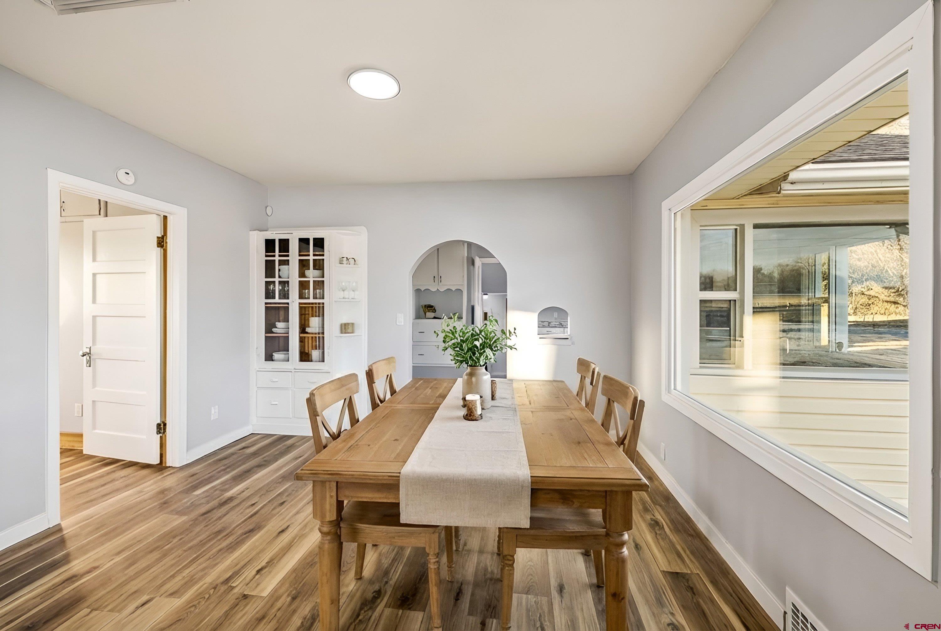 6038 Townsend Road Delta, CO 81416 - Photo 12 of 45 a view of a dining room with furniture window and wooden floor