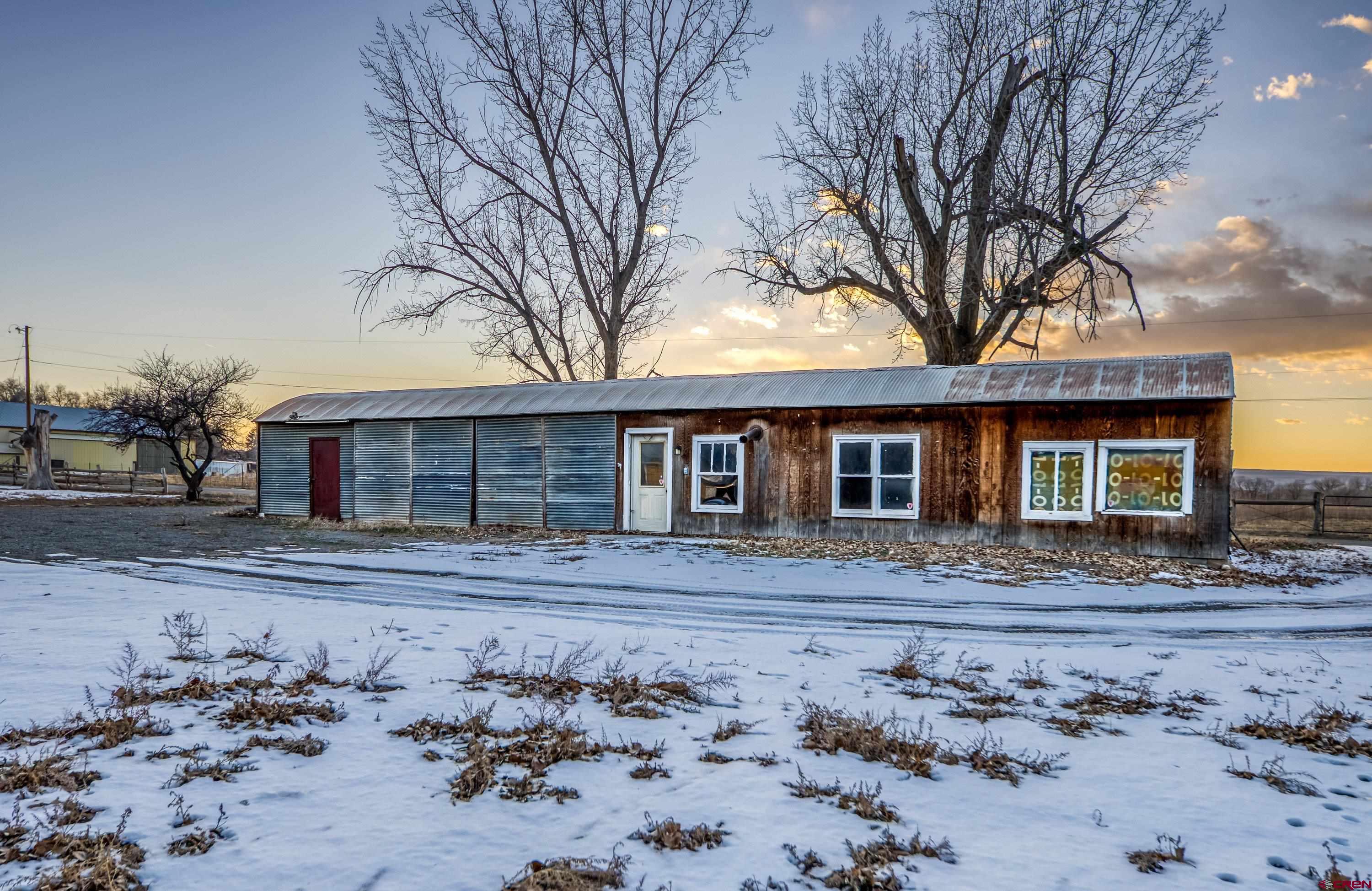 6038 Townsend Road Delta, CO 81416 - Photo 16 of 45 a front view of a house with a yard