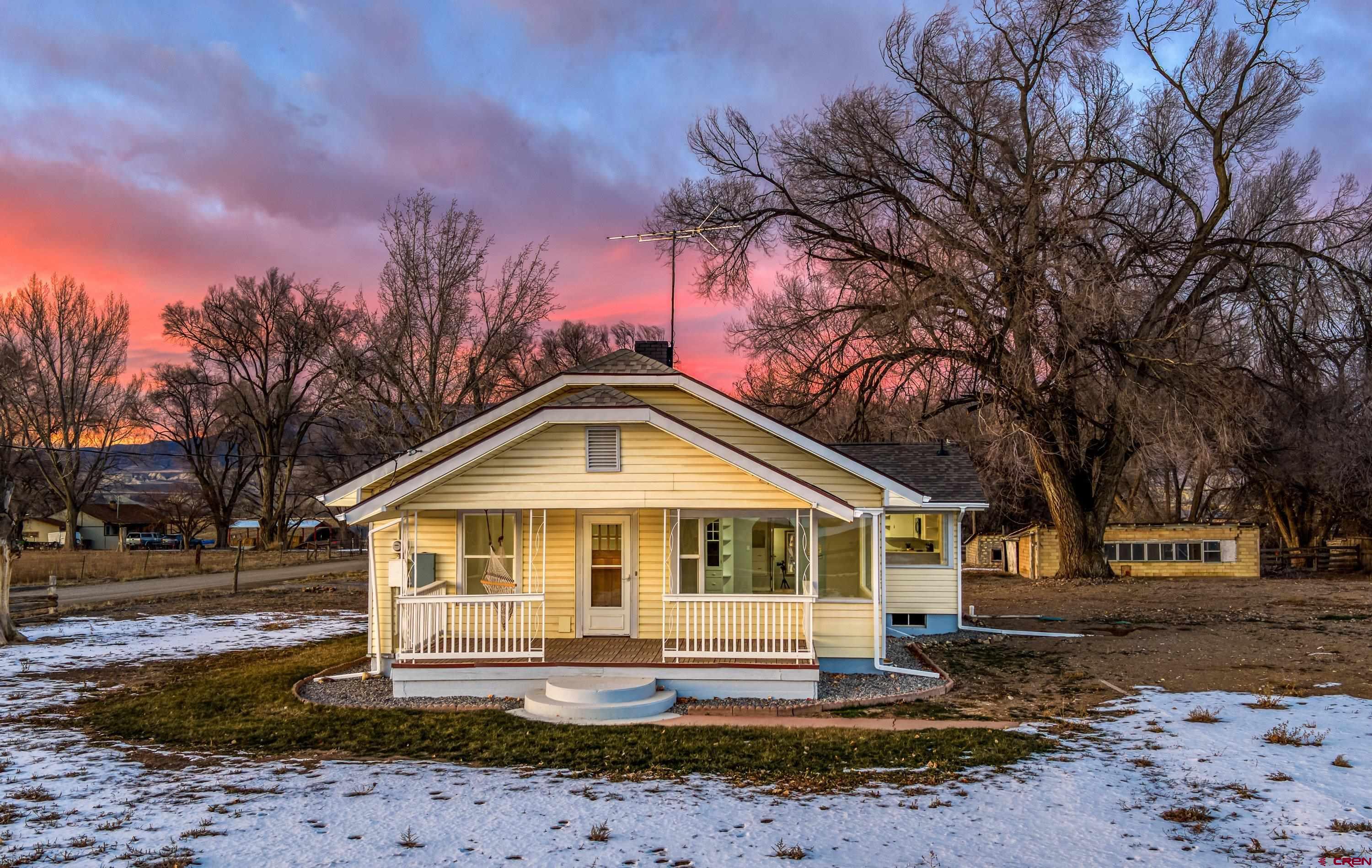6038 Townsend Road Delta, CO 81416 - Photo 36 of 45 a front view of a house with a yard