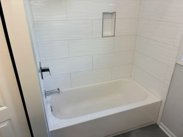 a close view of a bathtub in bathroom