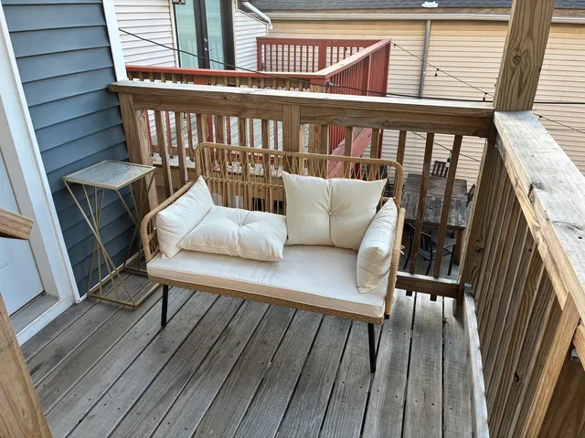 a view of a balcony with furniture