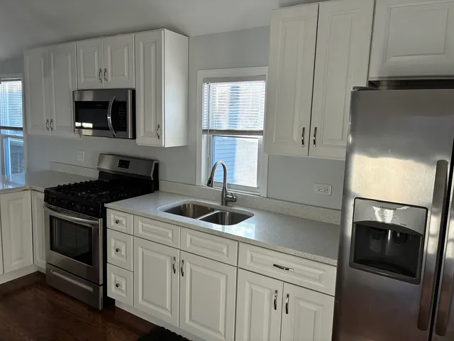 a kitchen with a sink and a stove