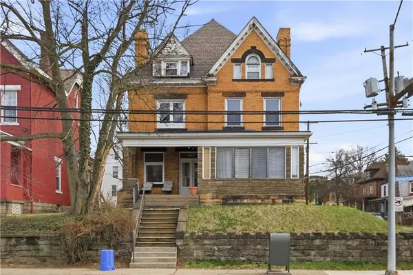 a view of a white building among the street