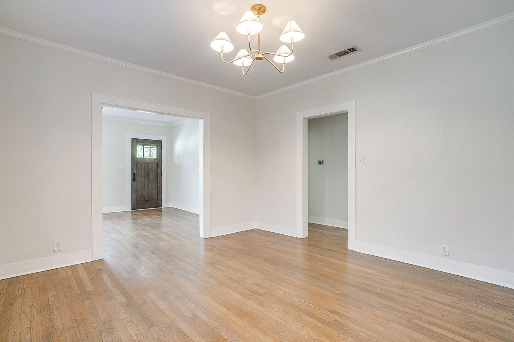 2209 West Rosedale Street South Fort Worth, TX 76110 - Photo 13 of 40 a view of an empty room with wooden floor