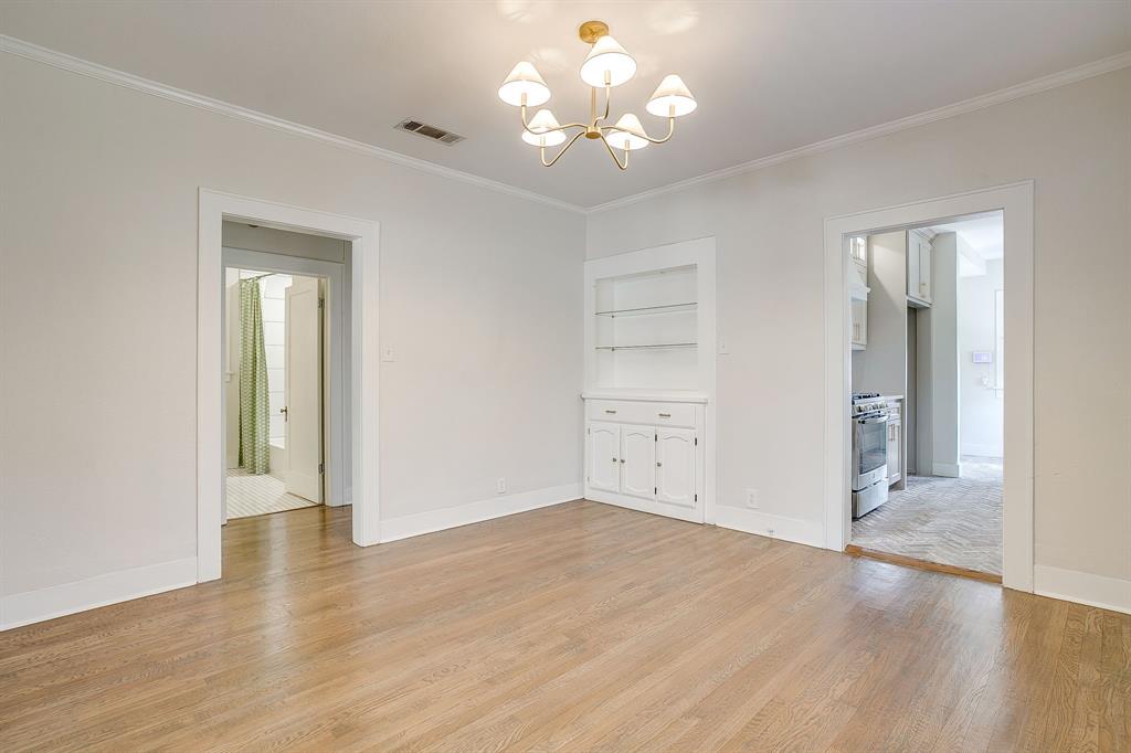 2209 West Rosedale Street South Fort Worth, TX 76110 - Photo 14 of 40 wooden floor in an empty room with a window