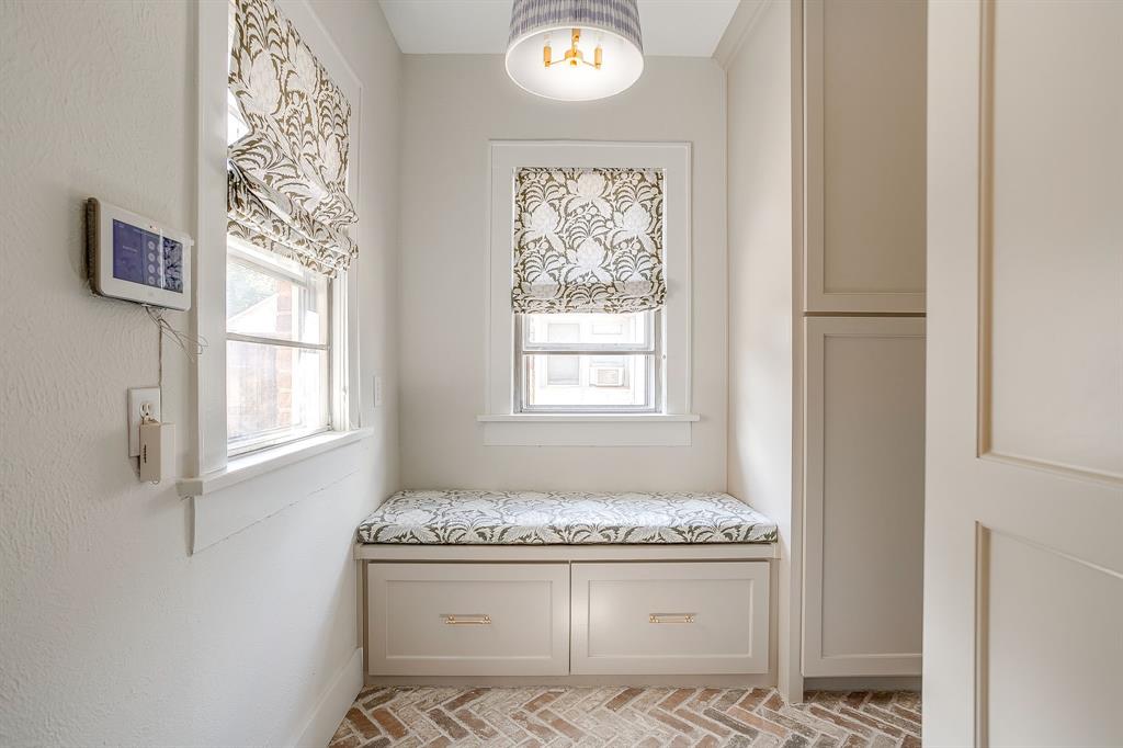 2209 West Rosedale Street South Fort Worth, TX 76110 - Photo 22 of 40 a bathroom with a granite countertop sink and a window