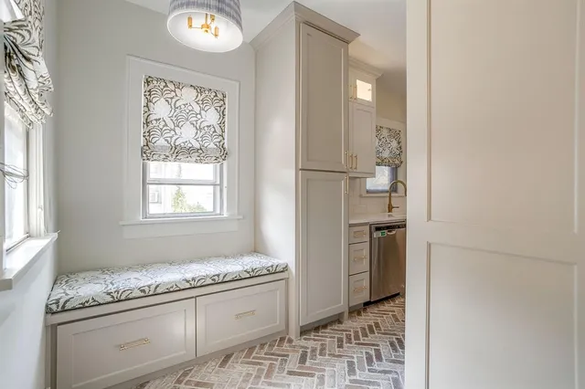 a kitchen with stainless steel appliances granite countertop a refrigerator and a stove