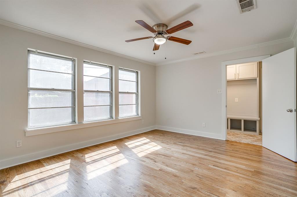 2209 West Rosedale Street South Fort Worth, TX 76110 - Photo 26 of 40 wooden floor in an empty room with a window