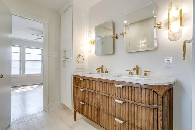 a bathroom with a sink a mirror and a shower