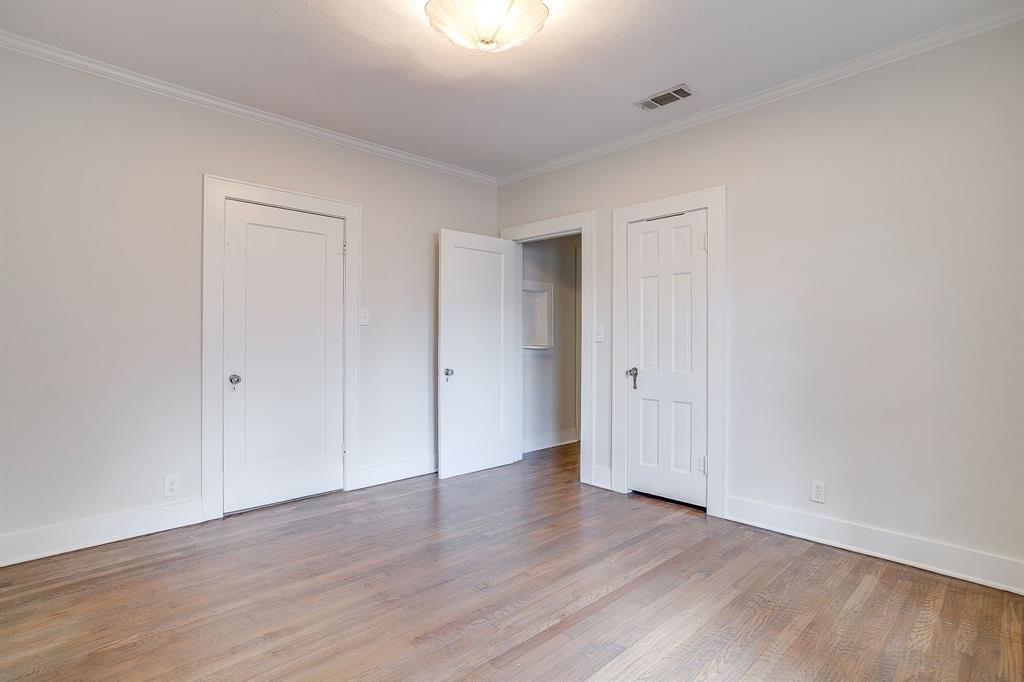 2209 West Rosedale Street South Fort Worth, TX 76110 - Photo 37 of 40 a view of an empty room with wooden floor