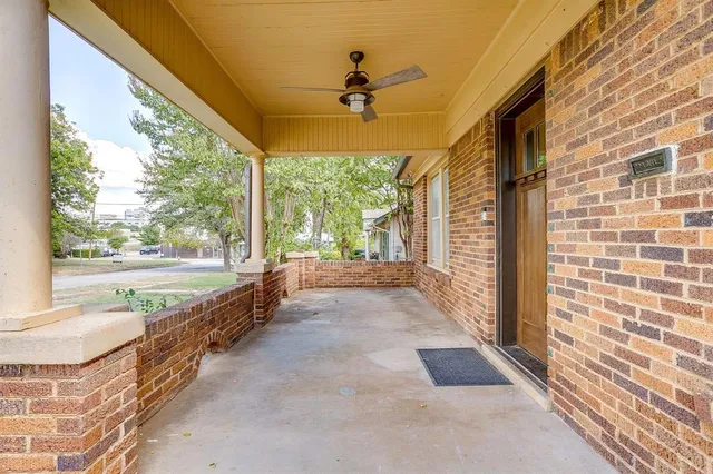 a view of a porch with a floor to ceiling window