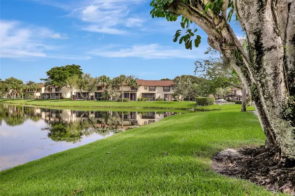 a view of a lake with a yard