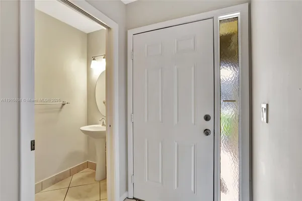a bathroom with a shower and a sink