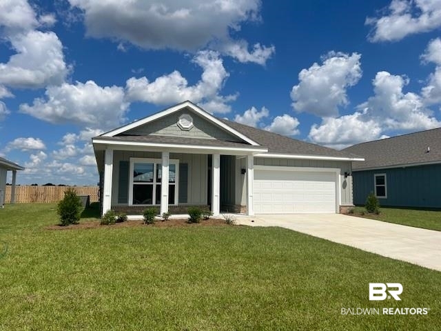 1045 Hayward Loop Foley, AL 36535 - Photo 1 of 12 Single story home featuring covered porch, driveway, a garage, and board and batten siding