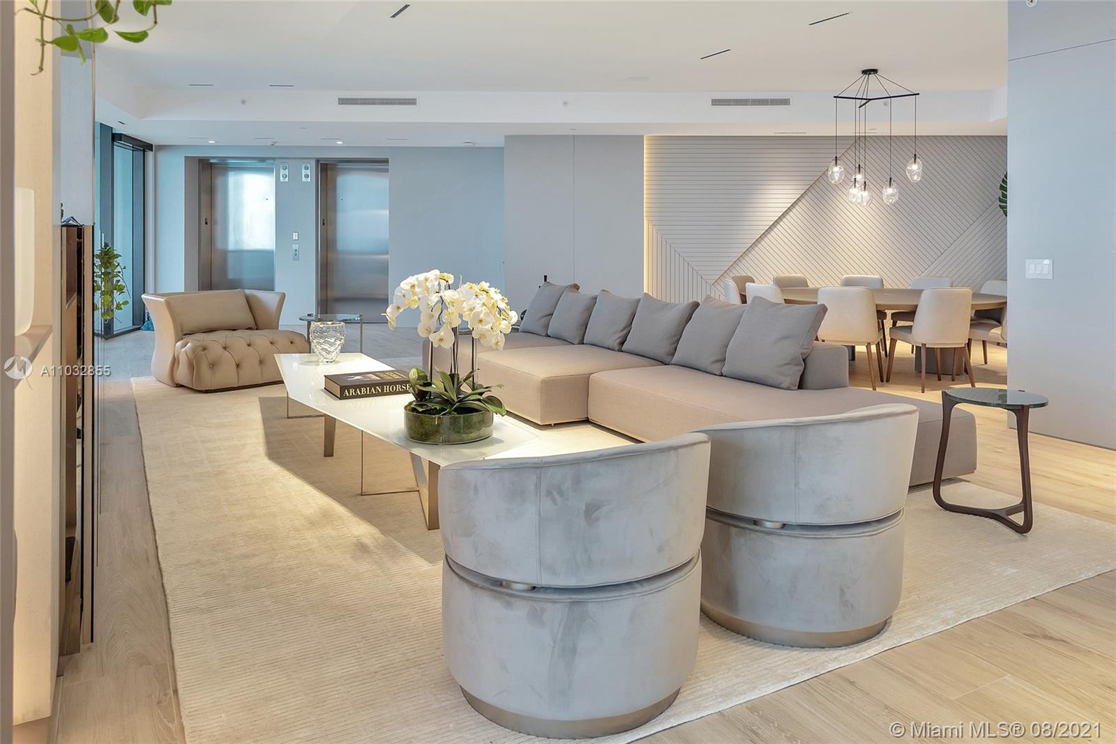 North Biscayne Beach Sunny Isles Beach, FL 33160 - Photo 16 of 52 a living room with couches and a dining table with kitchen view