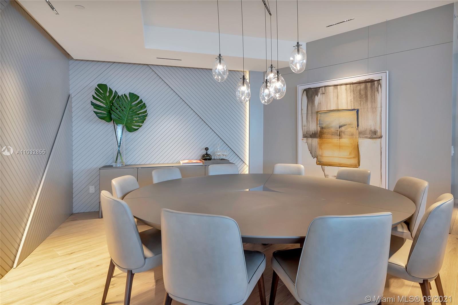 North Biscayne Beach Sunny Isles Beach, FL 33160 - Photo 17 of 52 a view of a dining room with furniture and chandelier