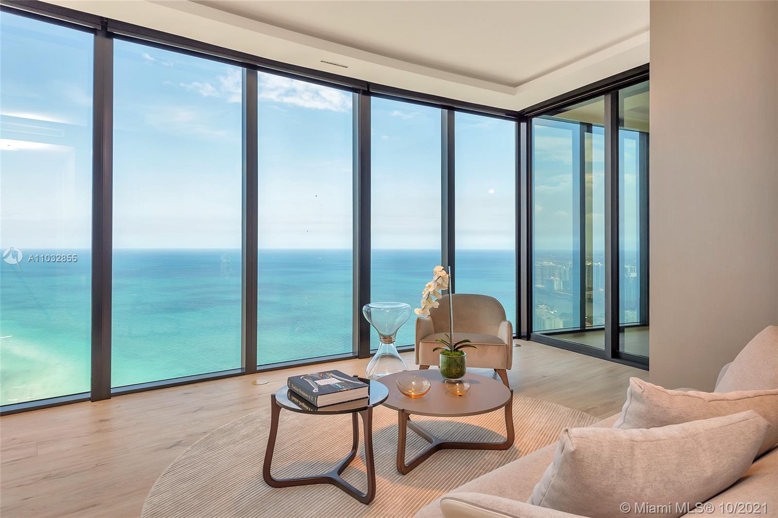 North Biscayne Beach Sunny Isles Beach, FL 33160 - Photo 21 of 52 a living room with furniture and a floor to ceiling window